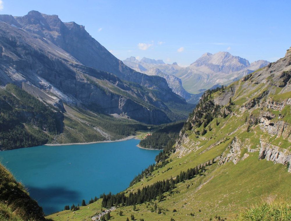 Oeaschinensee, an emerald blue lake above Kandersteg, is a must see on a hiking tour in the Bernese Oberland